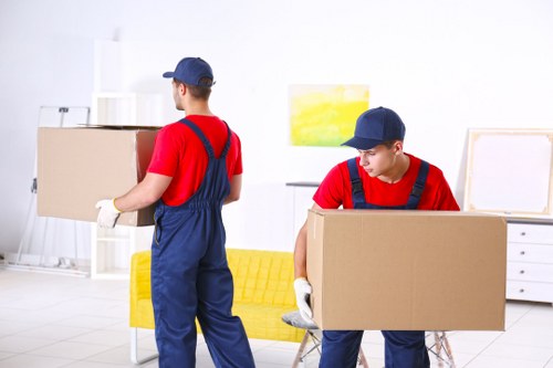 Removal van and moving team planning a house move in Bow