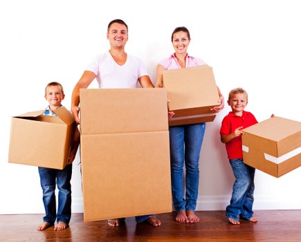 Packed office equipment and furniture ready for relocation in East London