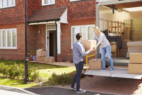 Removal van service for local moving in Bow with boxes and furniture