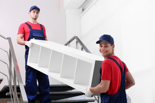 Man and van moving boxes and furniture in Bow