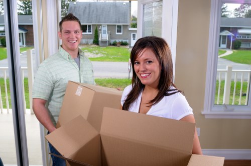 Boxes and personal items arranged for student removals in Bow