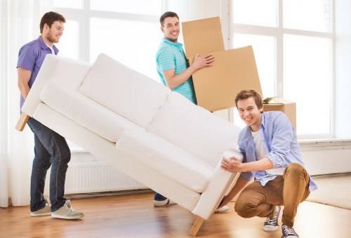 Careful loading of furniture and boxes into a van in East London