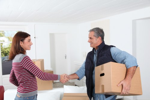Boxes and furniture being loaded for a same day move in Bow