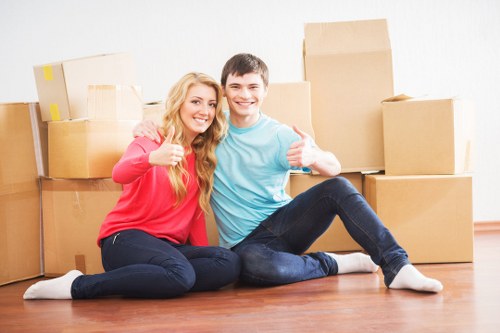 Packed office boxes and labelled furniture ready for relocation in East London